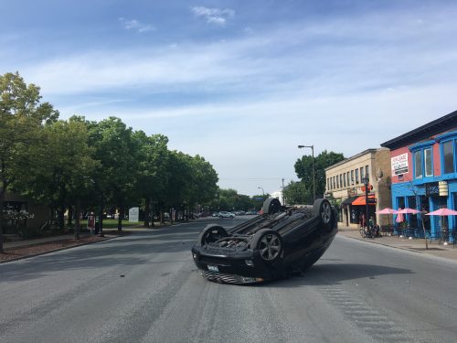 One of two cars involved in a crash on Hennepin Ave. between W 28th Street and the Uptown Transit Station. The vehicle was flipped over after it was broadsided by an oncoming car. August 9, 2019. Photo: Henry Pan