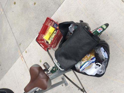 On a recent shopping trip, a Trader Joe's employee let me take a basket full of groceries out to my bike so I could load up my groceries in my panniers. After I loaded up my groceries, I returned the basket to the store. October 27, 2019. Photo: Henry Pan